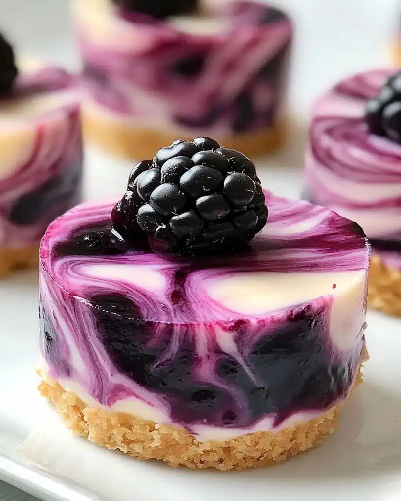 Decadent Blackberry Extract Mini Cheesecakes: Swirled Berry Bliss