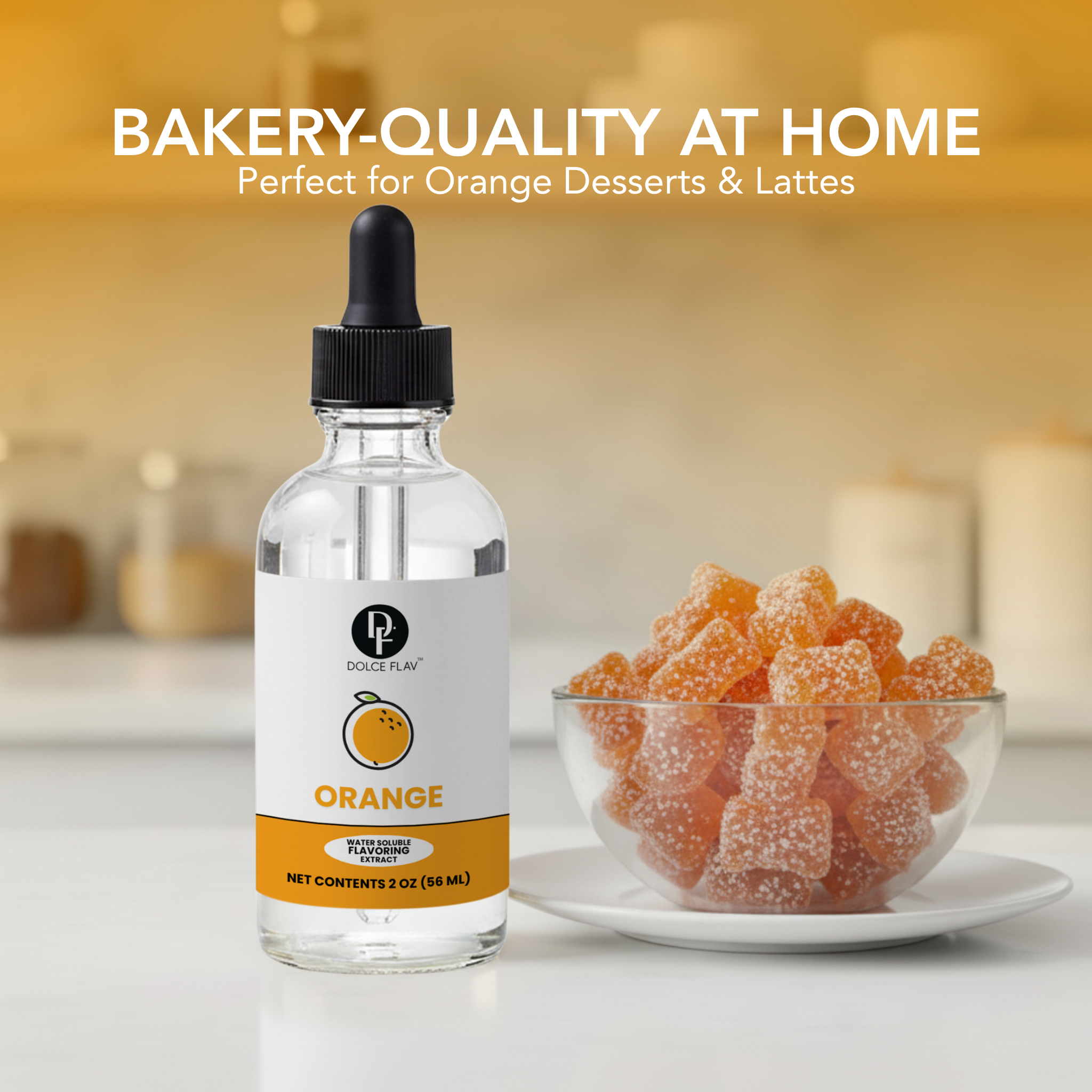 Bottle of orange-flavored syrup with a bowl of orange candies on a kitchen counter.